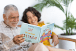 Mockup Of A Happy Senior Man Reading A Book To His Grandson M39439 2 1