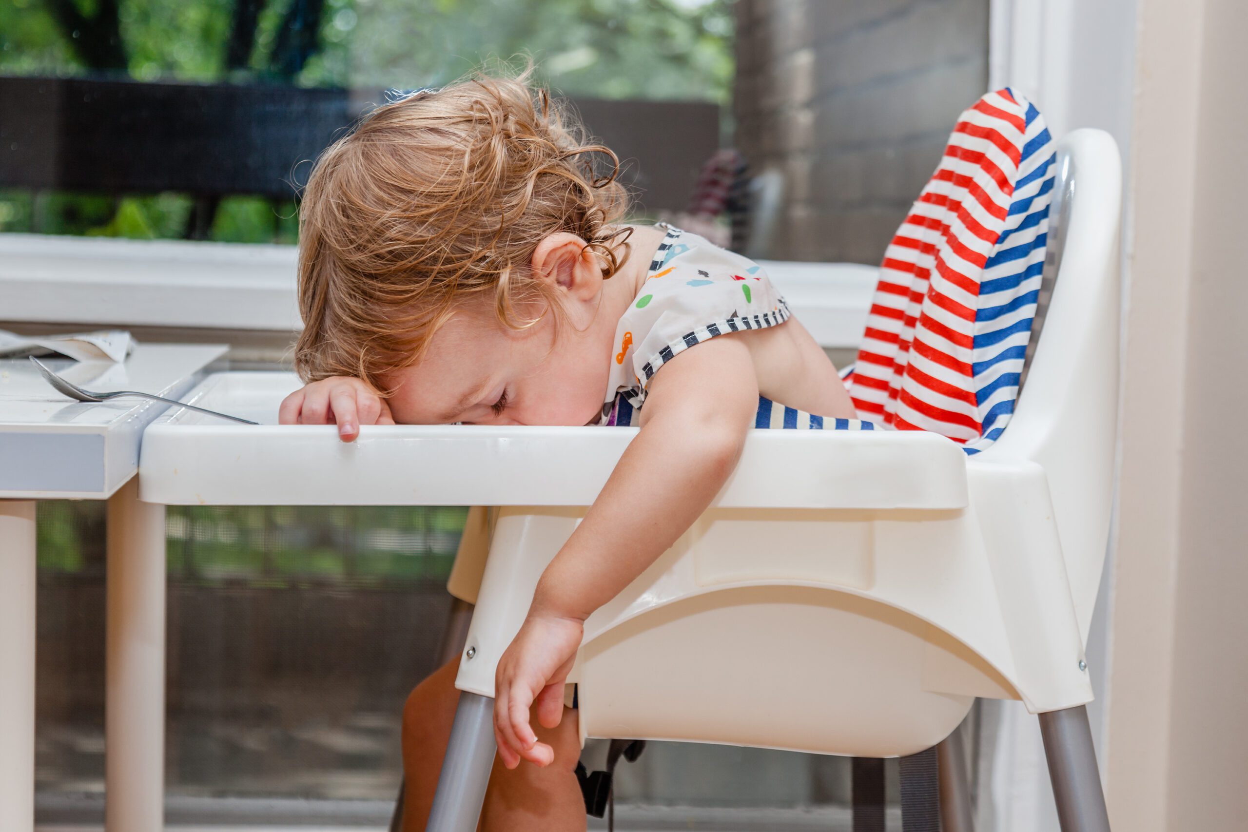 Tired,Child,Sleeping,In,Highchair,After,The,Lunch.,Baby,Over