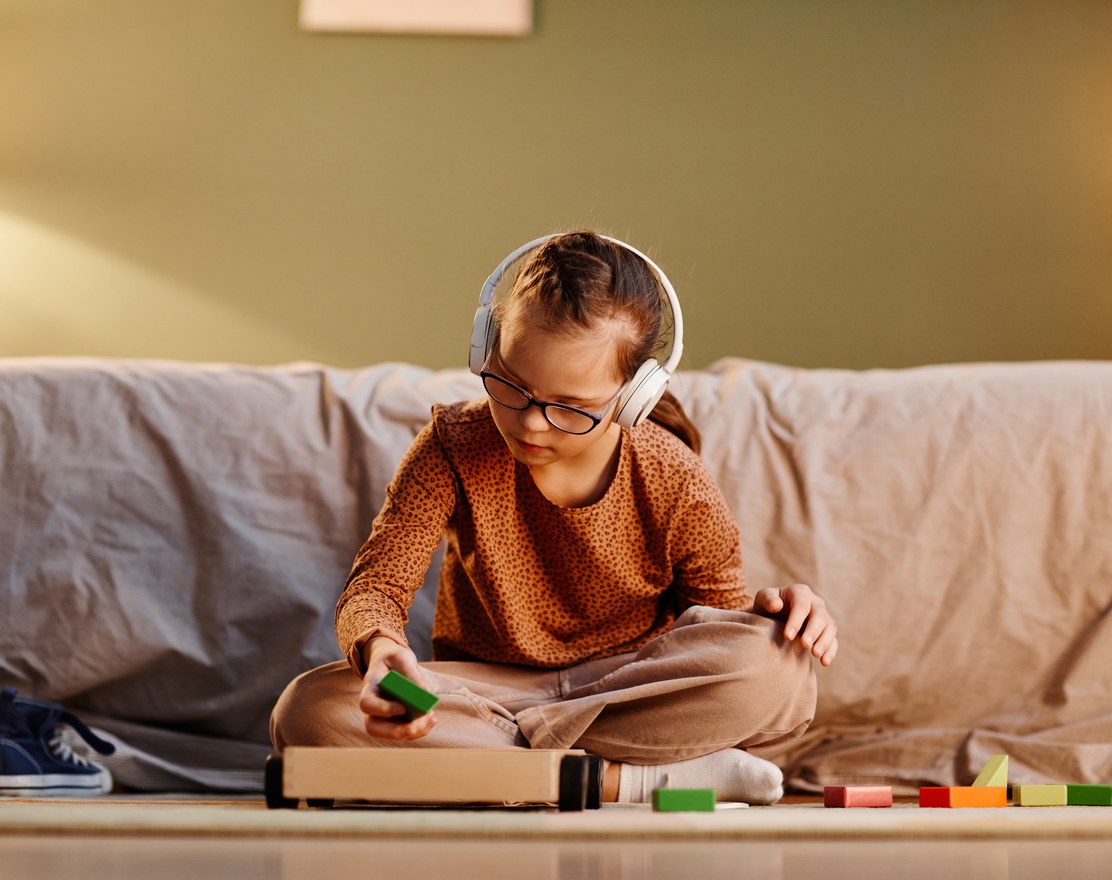 A therapist working with a child in a therapy room